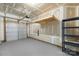 Spacious two-car garage with unfinished walls and shelving at 10225 Alexander Martin Ave, Charlotte, NC 28277