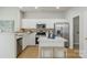 Modern kitchen featuring stainless steel appliances, island with seating and white cabinets at 10225 Alexander Martin Ave, Charlotte, NC 28277
