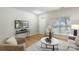 Bright and cozy living room with a view of the entryway and modern furnishings at 10225 Alexander Martin Ave, Charlotte, NC 28277