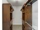 A walk-in closet is fitted with shelving and hanging rods at 10225 Alexander Martin Ave, Charlotte, NC 28277