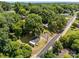 Aerial view of a charming home surrounded by lush greenery, mature trees and nestled in a tranquil neighborhood at 103 Garfield Ave, Albemarle, NC 28001