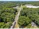 Aerial view of a charming home surrounded by lush greenery, mature trees and nestled in a tranquil neighborhood at 103 Garfield Ave, Albemarle, NC 28001