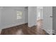 Cozy bedroom features hardwood floors, natural light, and neutral color scheme at 103 Garfield Ave, Albemarle, NC 28001