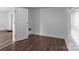 Bright bedroom features hardwood floors, neutral paint, and a spacious feel at 103 Garfield Ave, Albemarle, NC 28001