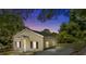 Charming single-story home with neutral siding, black shutters, complemented by lush greenery at 103 Garfield Ave, Albemarle, NC 28001