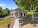Lovely single-story home with classic charm, featuring a welcoming sidewalk and well-maintained lawn at 103 Garfield Ave, Albemarle, NC 28001