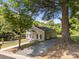 Inviting single-story home featuring a gravel driveway and a classic, cozy appearance at 103 Garfield Ave, Albemarle, NC 28001