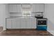 Clean kitchen showcasing stainless oven, bright light, and ample storage space at 103 Garfield Ave, Albemarle, NC 28001