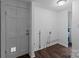 Laundry room with access to an outside door and water heater at 103 Garfield Ave, Albemarle, NC 28001