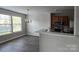 Comfortable living space with hardwood floors, a view of the kitchen, and an abundance of natural light at 1104 Plaza Walk Dr, Charlotte, NC 28215