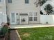 Fenced backyard offers a cozy patio area and a well-maintained lawn perfect for outdoor enjoyment at 12378 Swan Wings Pl, Huntersville, NC 28078