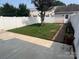 Backyard featuring a lawn, patio, storage shed, and wood fence at 12378 Swan Wings Pl, Huntersville, NC 28078