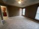 A bedroom with a ceiling fan, neutral carpet, and a closet at 12378 Swan Wings Pl, Huntersville, NC 28078