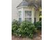 Bay window nestled among lush greenery offering tons of natural light at 12378 Swan Wings Pl, Huntersville, NC 28078