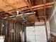 Partially unfinished garage interior with white door at 12378 Swan Wings Pl, Huntersville, NC 28078