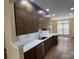 Modern kitchen featuring stainless steel appliances, subway tile backsplash, and ample counter space at 12378 Swan Wings Pl, Huntersville, NC 28078