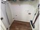 Compact laundry room with shelving for supplies and space for storage at 12378 Swan Wings Pl, Huntersville, NC 28078