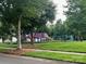 A community playground in a grassy park area at 12378 Swan Wings Pl, Huntersville, NC 28078
