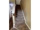 Carpeted staircase leads to the upper level at 12378 Swan Wings Pl, Huntersville, NC 28078
