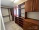 Expansive walk-in closet with custom shelving, cabinets, and plenty of hanging space at 12378 Swan Wings Pl, Huntersville, NC 28078