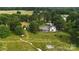 A bird's eye view of the property showcasing the home, surrounding land, and outbuildings at 1238 Carl Allen Rd, Edgemoor, SC 29712