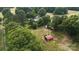 A rural property with multiple outbuildings surrounded by lush greenery, offering a peaceful and private setting at 1238 Carl Allen Rd, Edgemoor, SC 29712