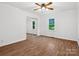 Bedroom featuring hardwood floors, a ceiling fan, a sliding door closet, and natural light from the window at 1238 Carl Allen Rd, Edgemoor, SC 29712