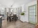 Bright dining area with wood floors, stylish decor, and stainless steel appliances in view at 1238 Carl Allen Rd, Edgemoor, SC 29712