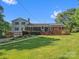A view of the home's exterior featuring a ramp, screened porch, and attached garage at 1238 Carl Allen Rd, Edgemoor, SC 29712