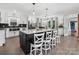 Spacious kitchen featuring a large island with seating, modern appliances, and ample natural light at 1238 Carl Allen Rd, Edgemoor, SC 29712