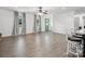 Bright living room with hardwood floors, wainscotting and a green front door and updated light fixture at 1238 Carl Allen Rd, Edgemoor, SC 29712