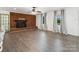 Inviting living room with brick fireplace, hardwood floors, updated lighting, and neutral paint at 1238 Carl Allen Rd, Edgemoor, SC 29712