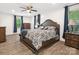 Main bedroom featuring hardwood floors, neutral walls, and generous natural light from windows at 1238 Carl Allen Rd, Edgemoor, SC 29712