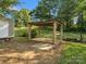 Rustic wooden pavilion with a concrete base, perfect for outdoor gatherings and relaxation at 1238 Carl Allen Rd, Edgemoor, SC 29712