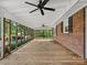 Spacious screened-in porch with wood flooring, ideal for enjoying the outdoors at 1238 Carl Allen Rd, Edgemoor, SC 29712