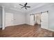 Main bedroom with hardwood floors, tray ceiling, ceiling fan, and en-suite bathroom at 129 John Smith Rd, York, SC 29745