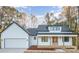 Charming modern farmhouse with a covered porch, attached garage, and clean white siding at 129 John Smith Rd, York, SC 29745
