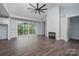 Spacious living room with fireplace, hardwood floors, and sliding glass doors to the deck at 129 John Smith Rd, York, SC 29745
