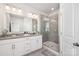 Bathroom with glass shower, granite counters, and neutral walls at 1428 Winding Stream Rd, Charlotte, NC 28206