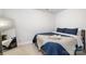 Bedroom with blue comforter and mirror at 1428 Winding Stream Rd, Charlotte, NC 28206