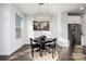 Bright dining area with stainless steel refrigerator and a designer light fixture at 1428 Winding Stream Rd, Charlotte, NC 28206