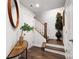 Entryway with wood floors, stairs, decor, and white door at 1428 Winding Stream Rd, Charlotte, NC 28206