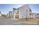 Street view of modern townhomes, showcasing attached garages and well-kept lawns at 1428 Winding Stream Rd, Charlotte, NC 28206