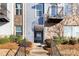 Charming townhome entrance with a cozy porch and well-manicured landscaping at 1428 Winding Stream Rd, Charlotte, NC 28206