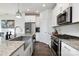 Modern kitchen featuring stainless steel appliances, granite countertops, and sleek fixtures at 1428 Winding Stream Rd, Charlotte, NC 28206