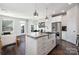 Bright and modern kitchen with center island and stainless steel appliances at 1428 Winding Stream Rd, Charlotte, NC 28206