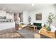 Cozy living room flows into the kitchen for easy entertaining and relaxed living at 1428 Winding Stream Rd, Charlotte, NC 28206