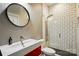 Modern bathroom features a vanity, round mirror, and shower with white subway tile at 16525 Tulloch Rd, Charlotte, NC 28278