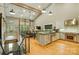 Open-concept kitchen and living area featuring stainless steel appliances and a modern design at 16525 Tulloch Rd, Charlotte, NC 28278
