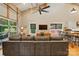 Inviting living area with a large sectional sofa, television, and modern farmhouse-style decor at 16525 Tulloch Rd, Charlotte, NC 28278